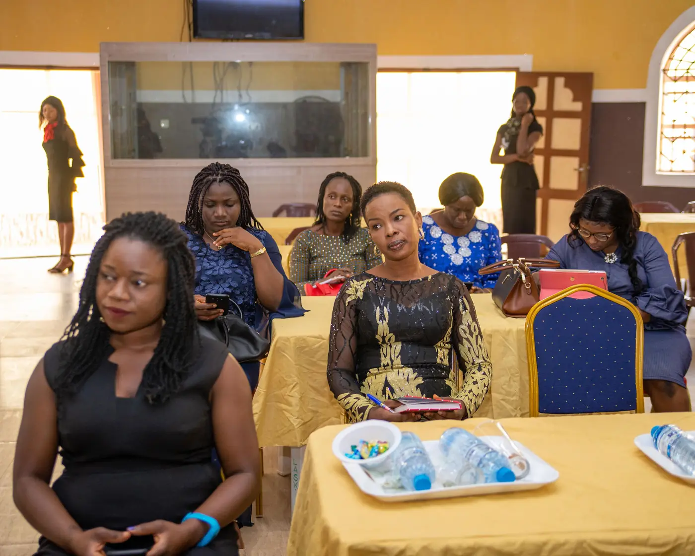 Women seated, listening